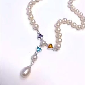 Freshwater pearl necklaces with gemstone, diamonds set 14k white gold.